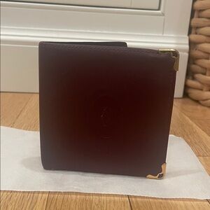 Burgundy Cartier Leather Bifold Wallet with Gold Accents